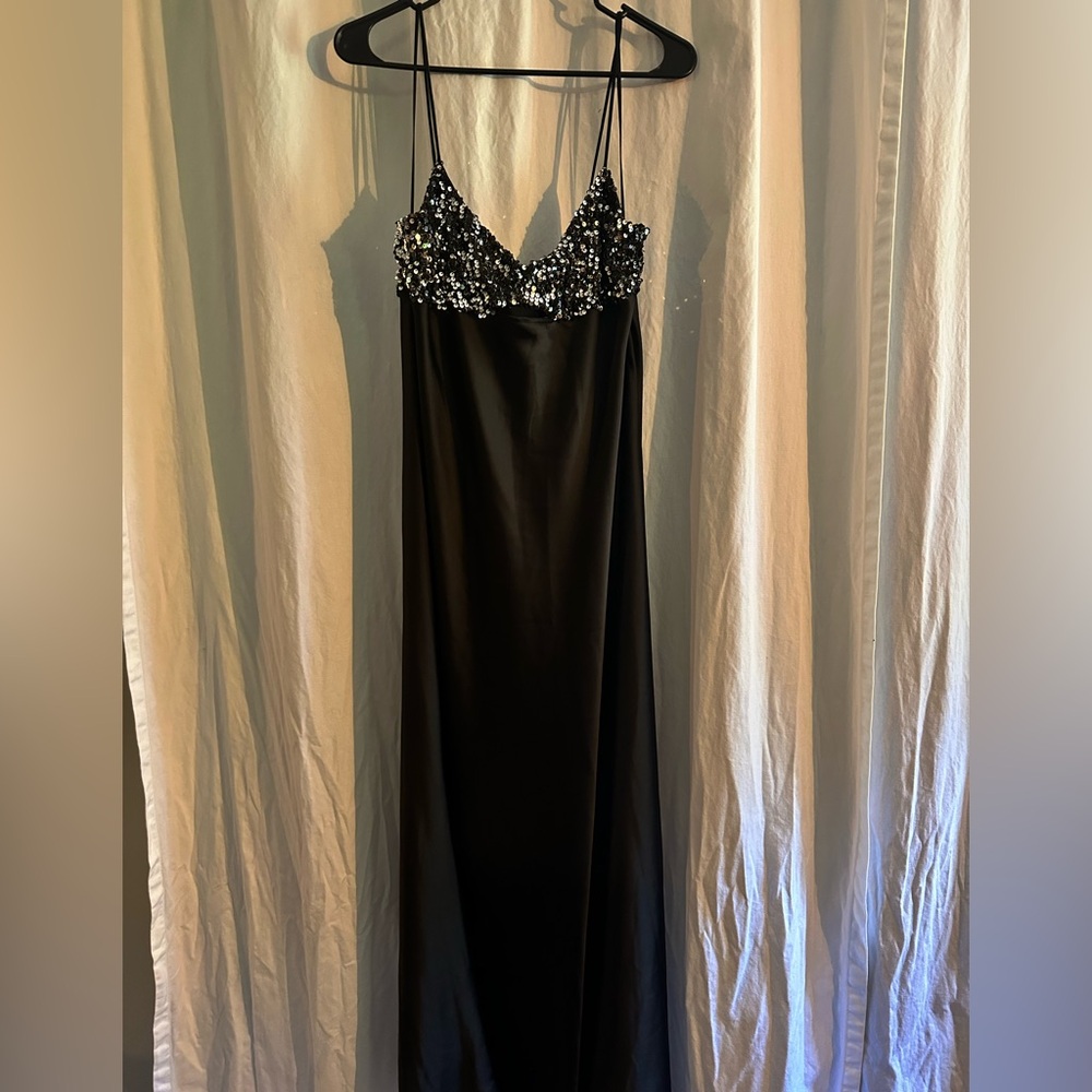 Black slip dress with sequin bustier and cutout detail